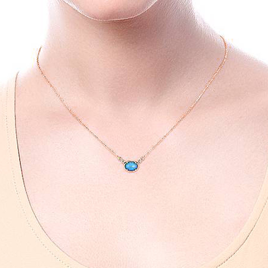 Wearing a Rock Crystal Turquoise & Diamond Necklace in 14k Rose Gold